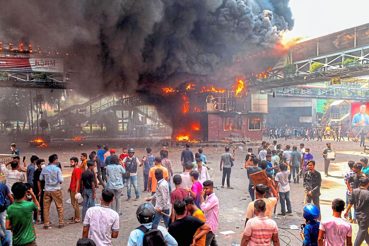 Dhaka bans rallies after wild fury