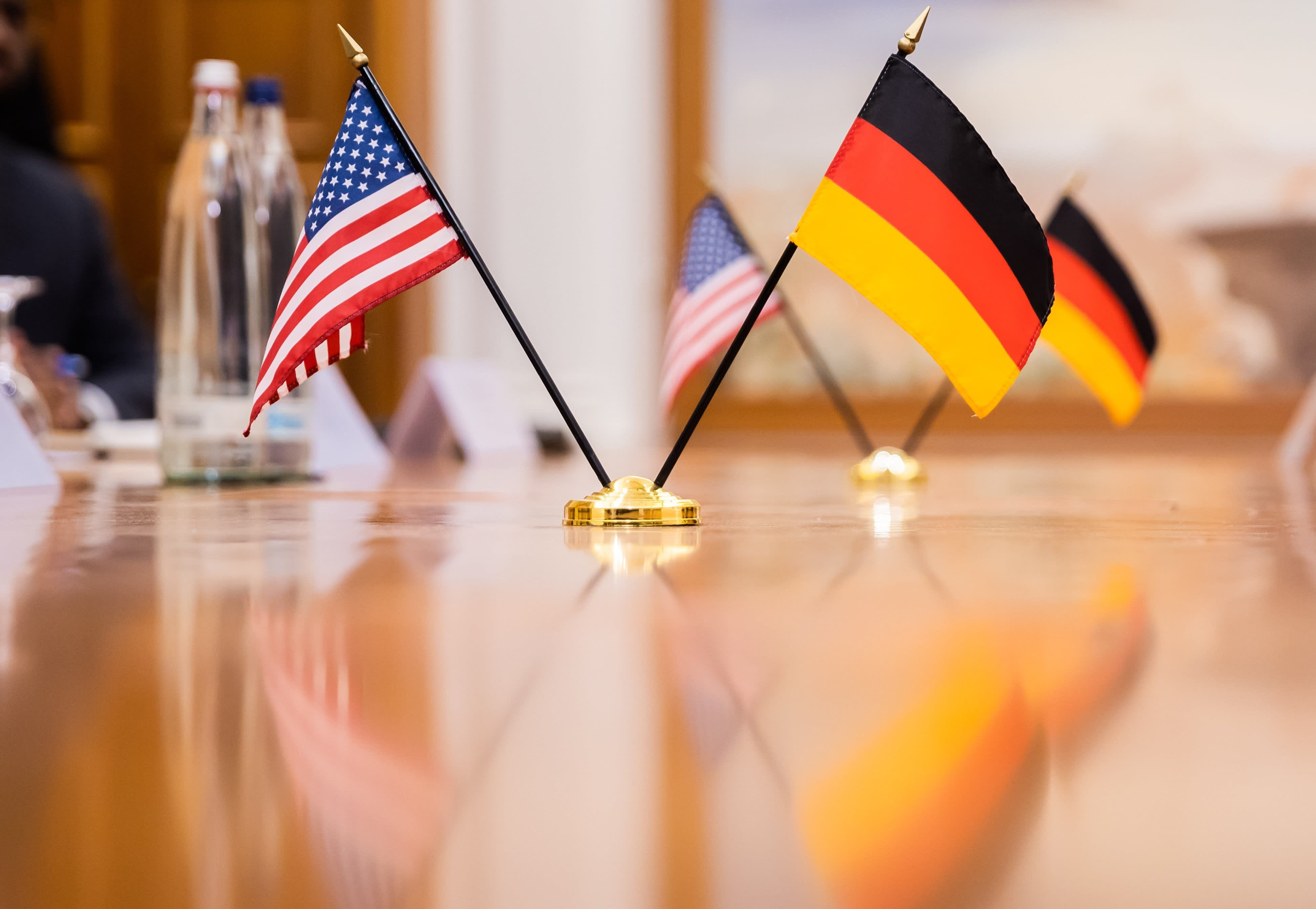 The flags of the U.S. and Germany are on the table at a bilateral meeting between German Economics Minister Habeck and U.S. Secretary of State Blinken at a hotel on the Gendarmenmarkt. Photo: Christoph Soeder/dpa (Photo by Christoph Soeder/picture alliance via Getty Images)