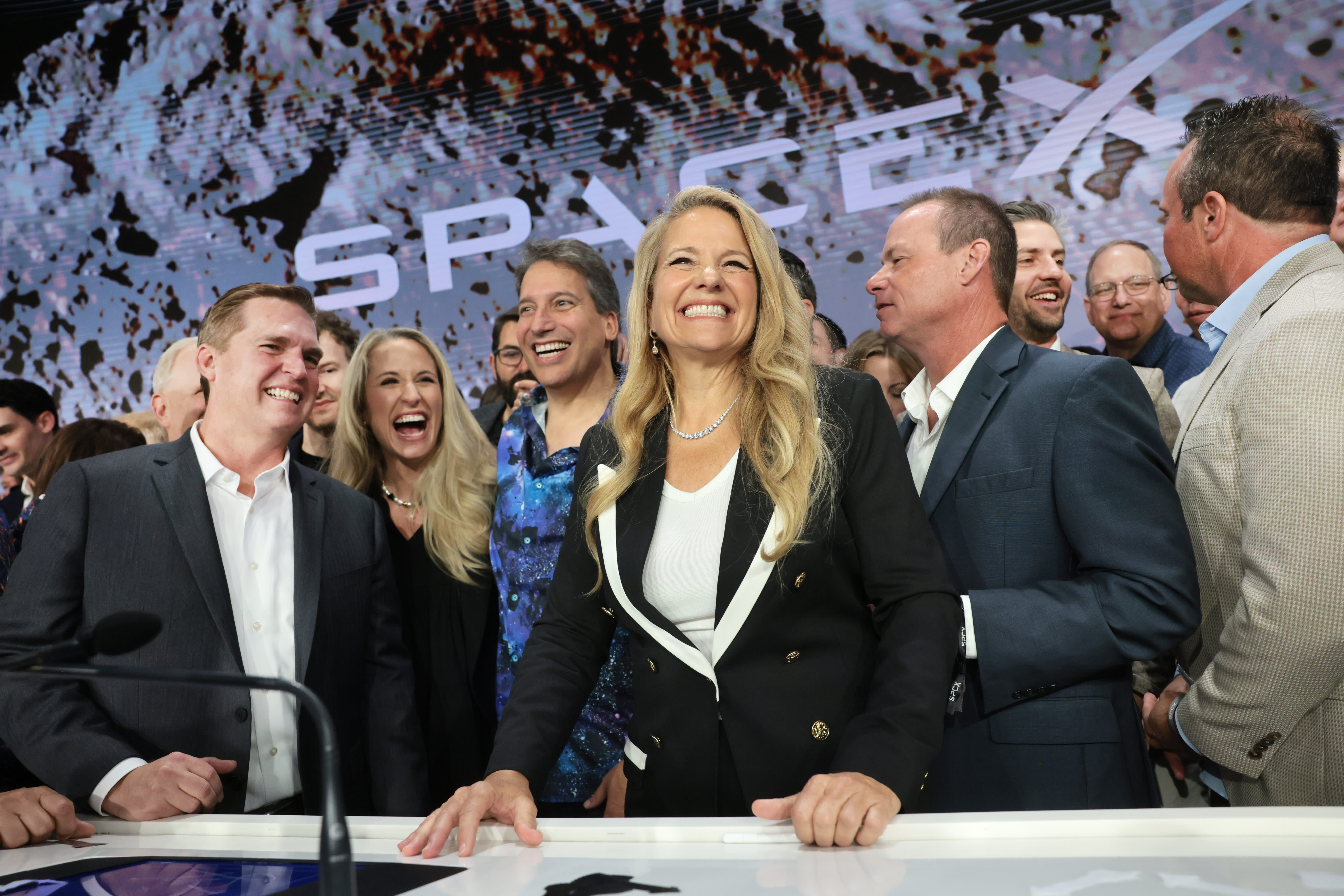 SpaceX President and Chief Operating Officer Gwynne Shotwell celebrates with family and other SpaceX employees at the Nasdaq Marketsite in in New York after the SpaceX initial public offering on June 12, 2026.